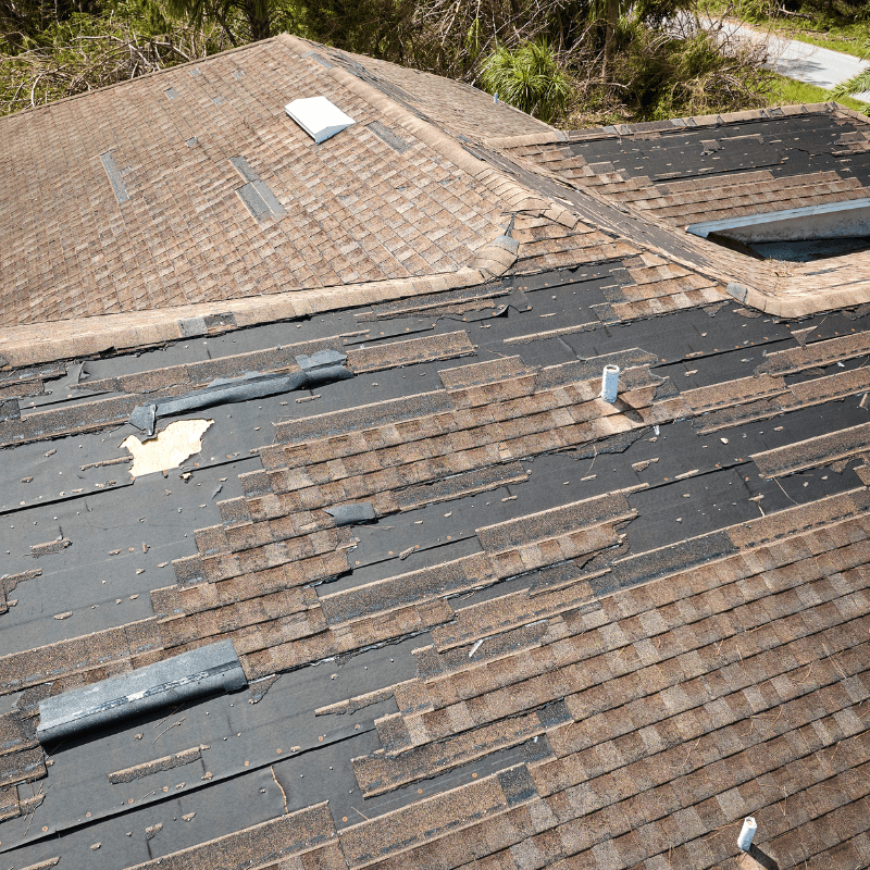 Image displaying a damaged roof indicating signs of necessary replacement.