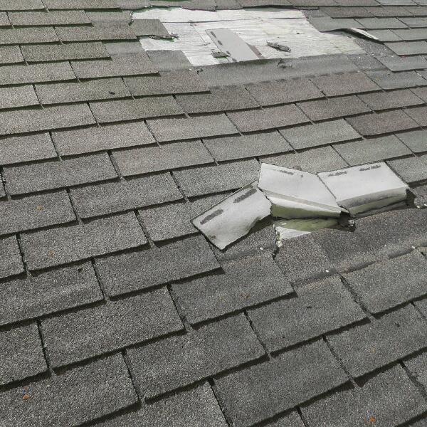 Image of a roof repaired after minor storm damage from a natural disaster.